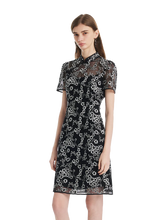 a lady in a black black floral embroidery cheongsam mini dress